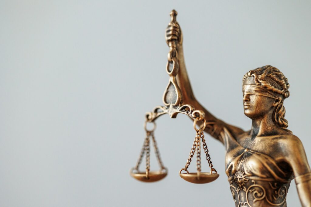 Legal Tech on Access to Justice . the symbol of justice and justice is a statuette of the goddess.