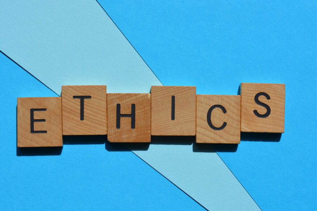Ethical use of AI Predictive Analytics. Ethics, word in wooden alphabet letters isolated on background as banner headline